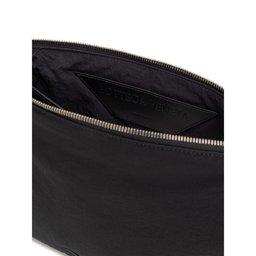 Black zippered pouch with brand label on inside