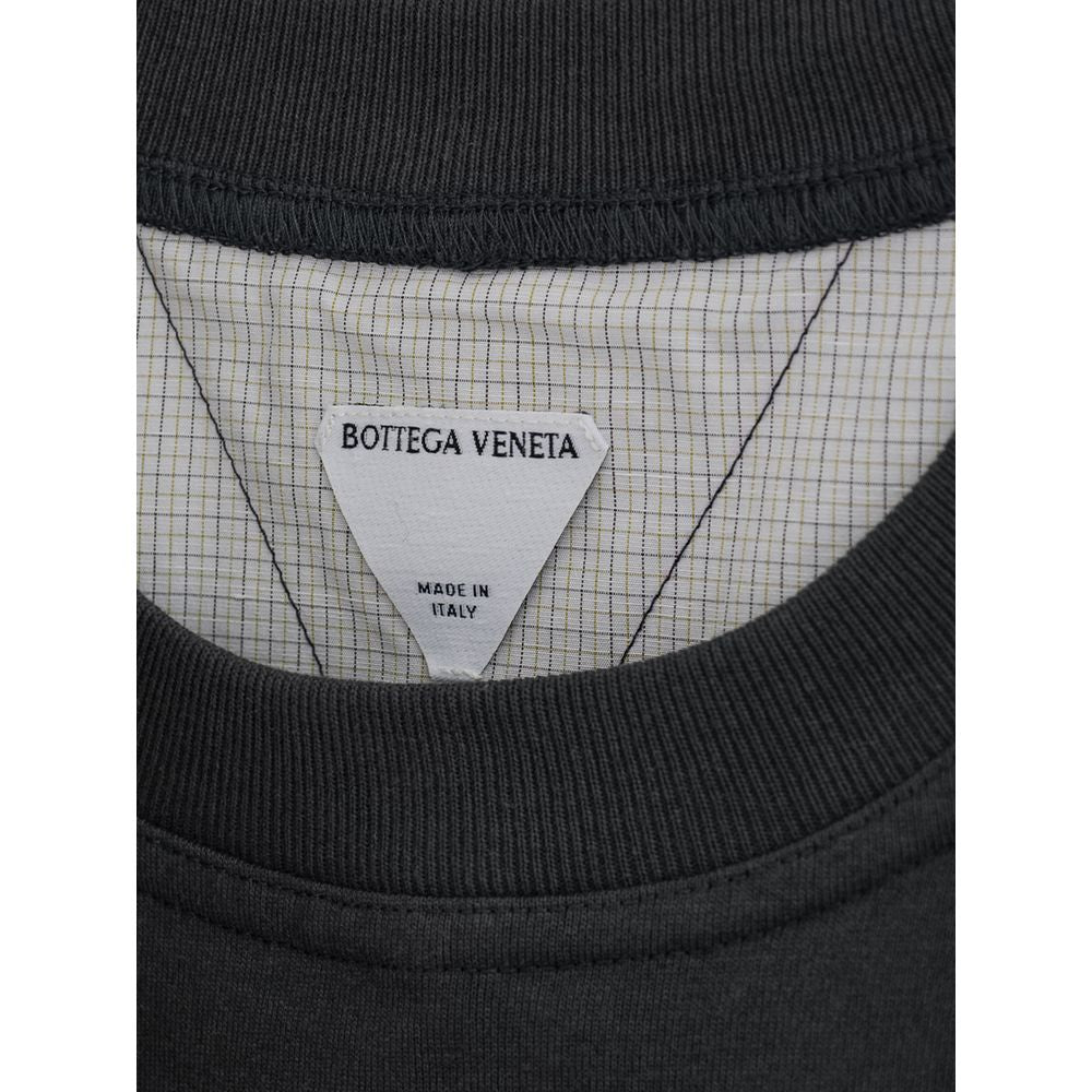 Black shirt with white label on neck