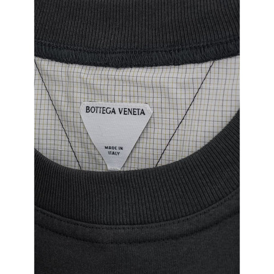 Black shirt with white label on neck