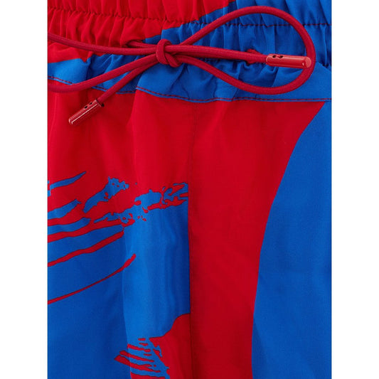 Red and blue swim trunks with a red tie