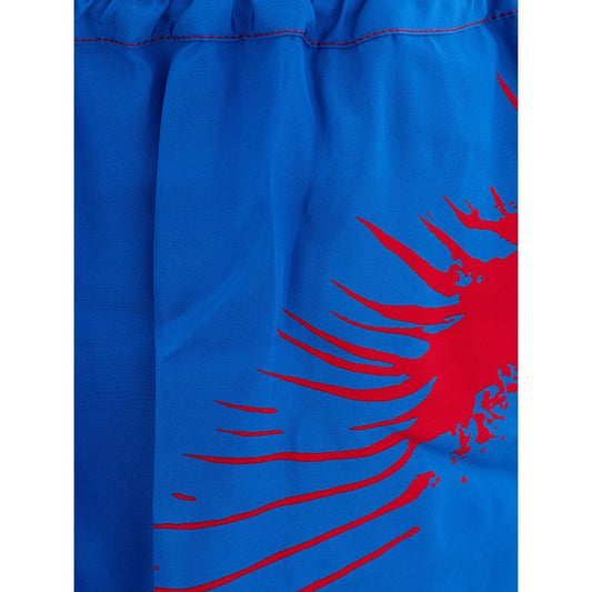 Blue swim trunks with red design on side