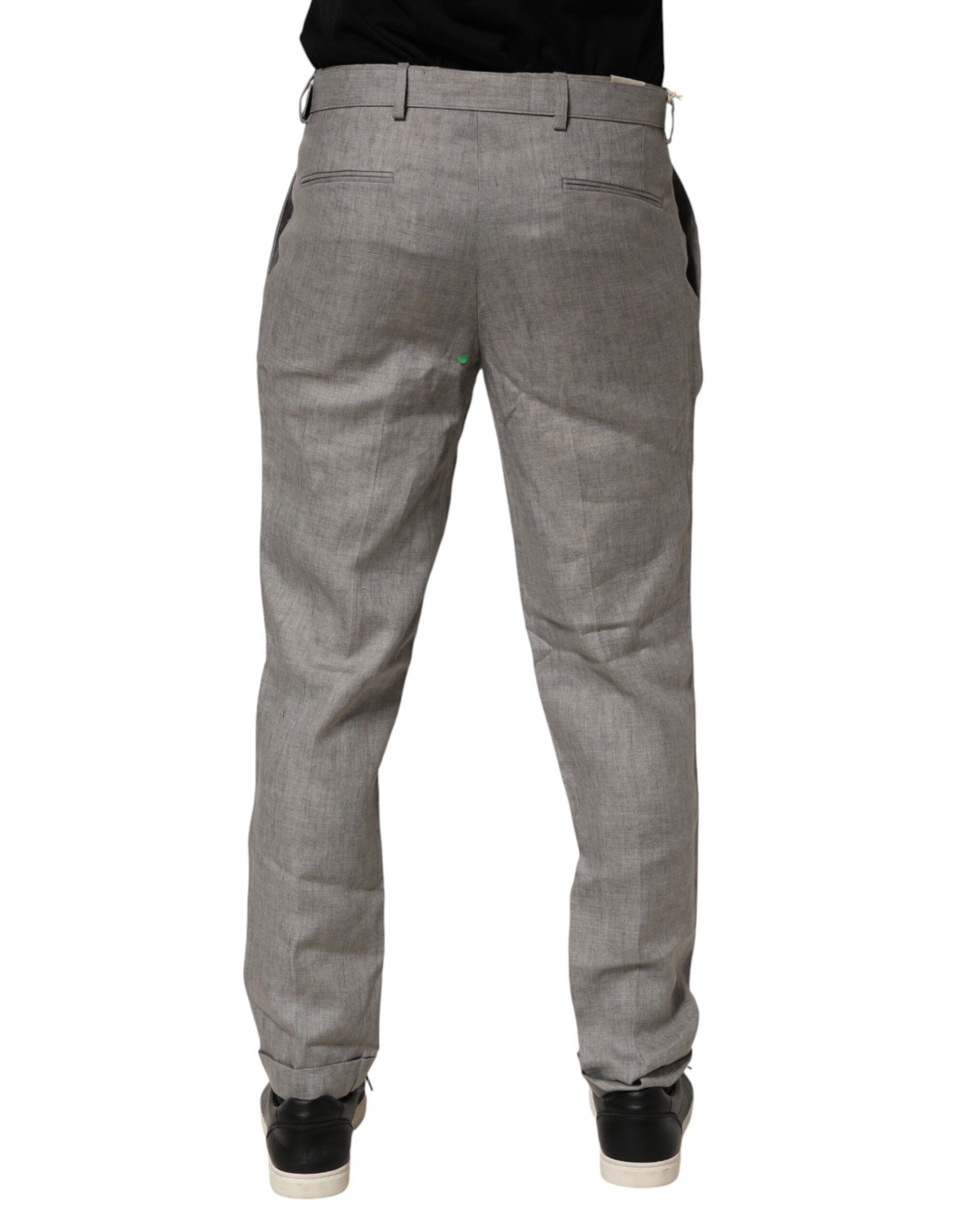 A pair of gray mid-waist dress pants with a skinny fit