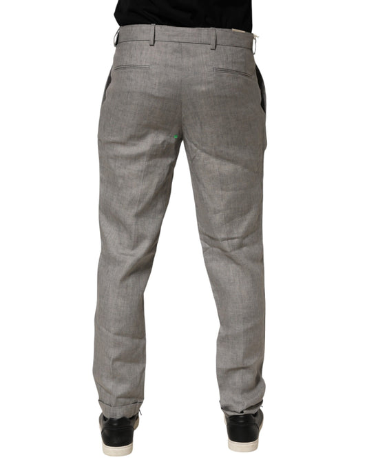 A pair of gray mid-waist dress pants with a skinny fit