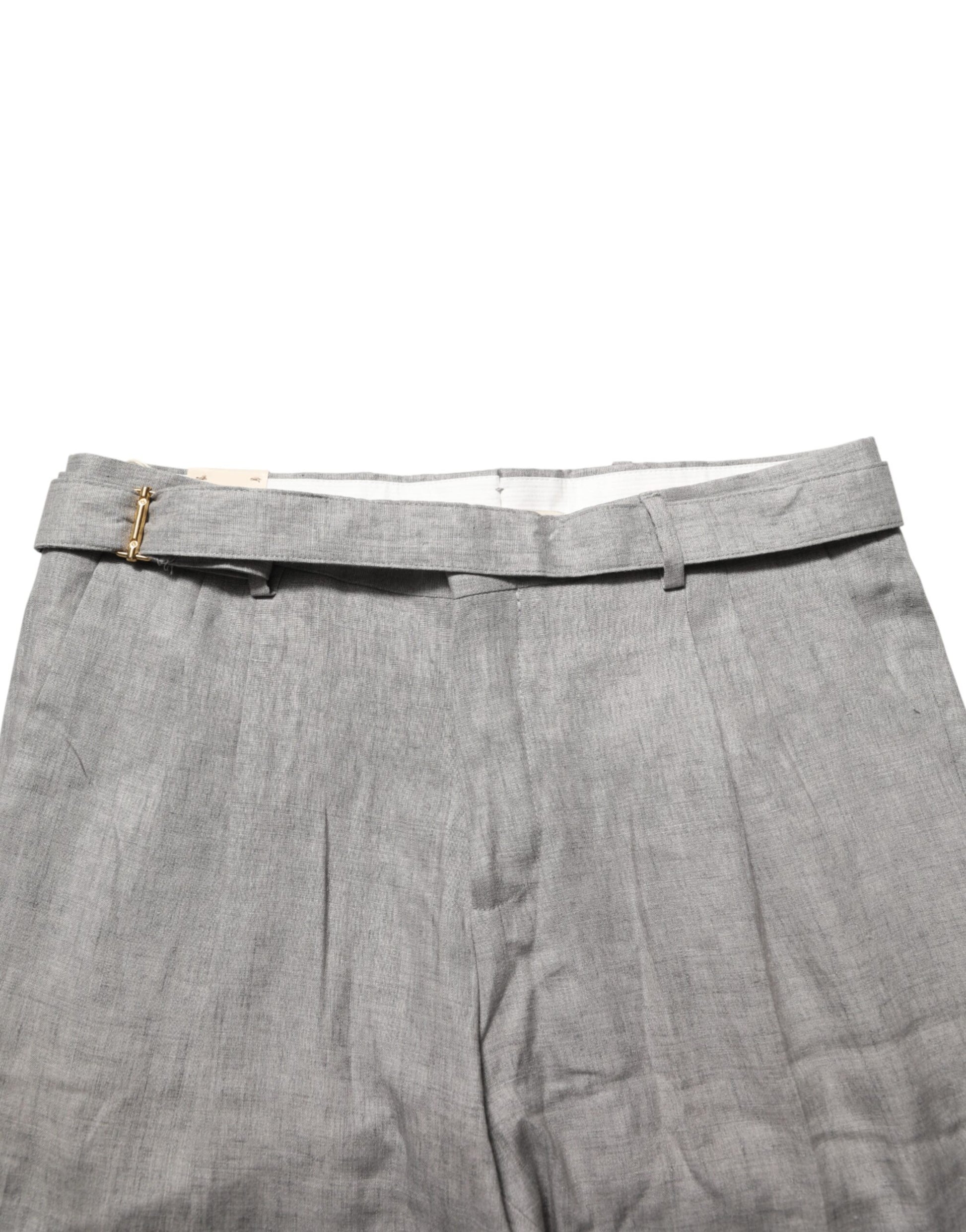 A pair of gray men's trousers with a mid-waist design, featuring a skinny fit and a buttoned front