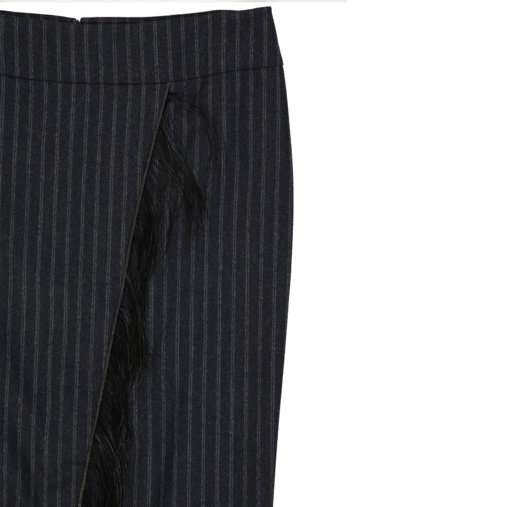 Pair of black pants with vertical stripes and fringe detailing
