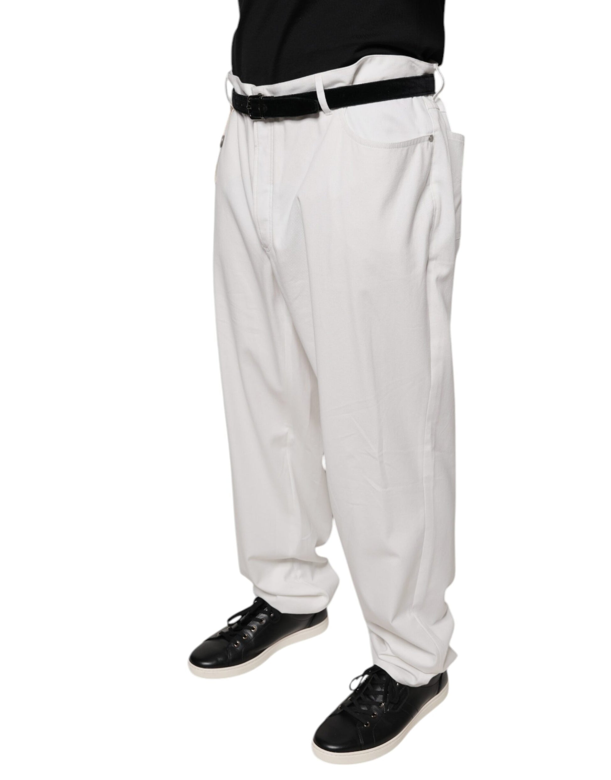 A pair of white cotton men's dress pants with a tapered fit