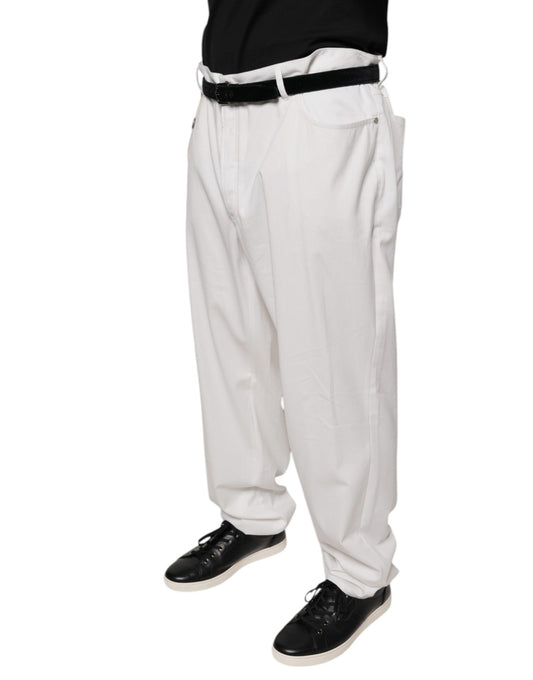 A pair of white cotton men's dress pants with a tapered fit