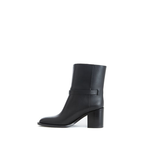 Black leather boot with a high heel and a strap across the top