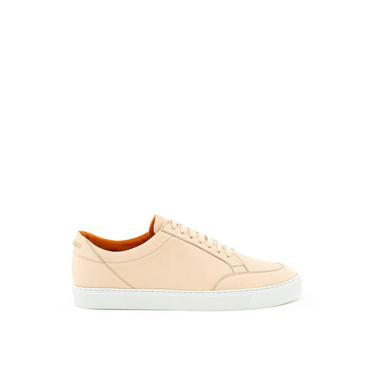 Pink sneakers with white soles and laces