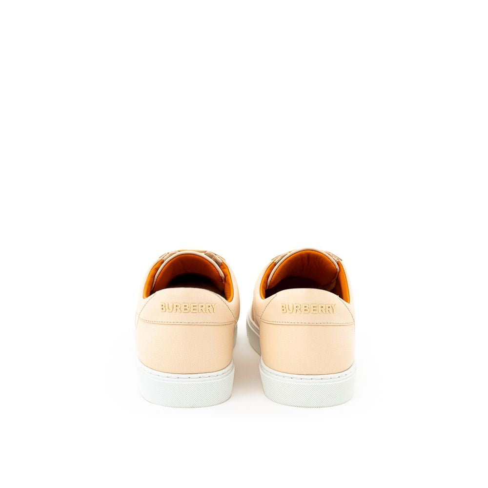 Pair of sneakers with white soles and laces