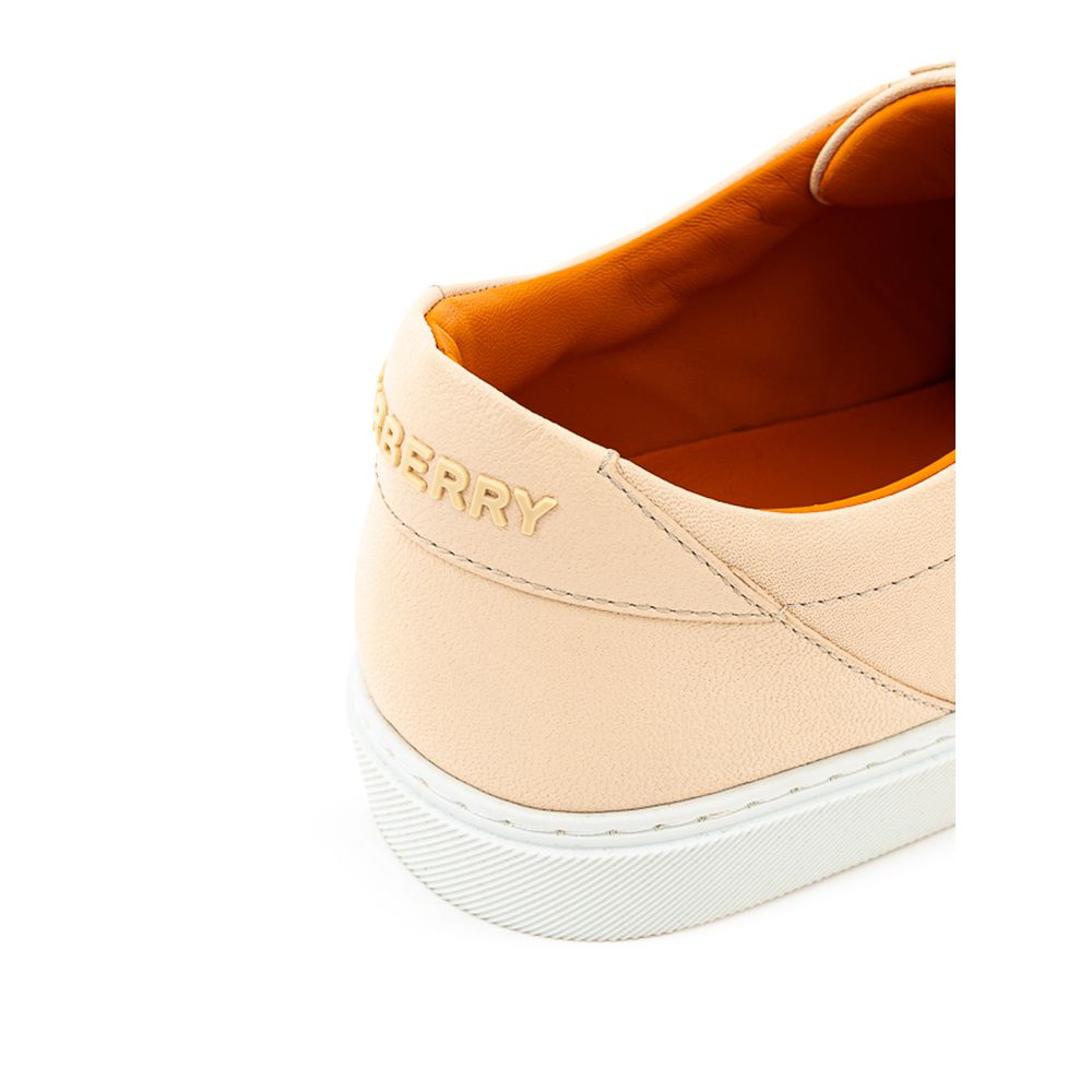 Tan sneaker with white sole and laces