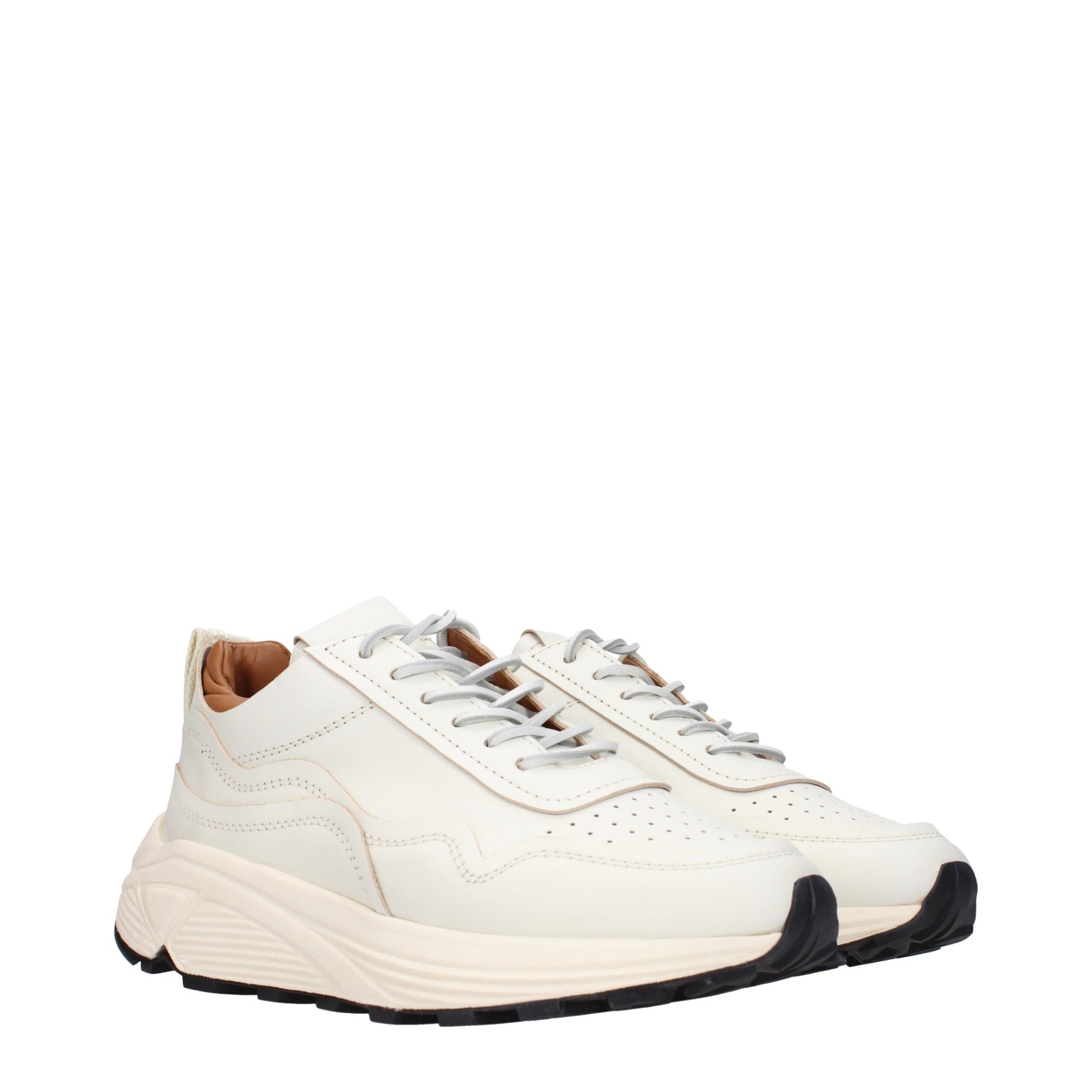 Pair of white leather low top sneakers with laces, featuring a flat sole and a minimalist design