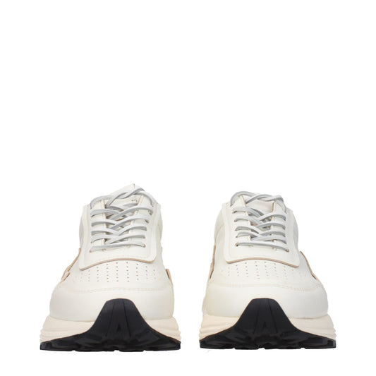 Pair of white leather low top sneakers with black laces