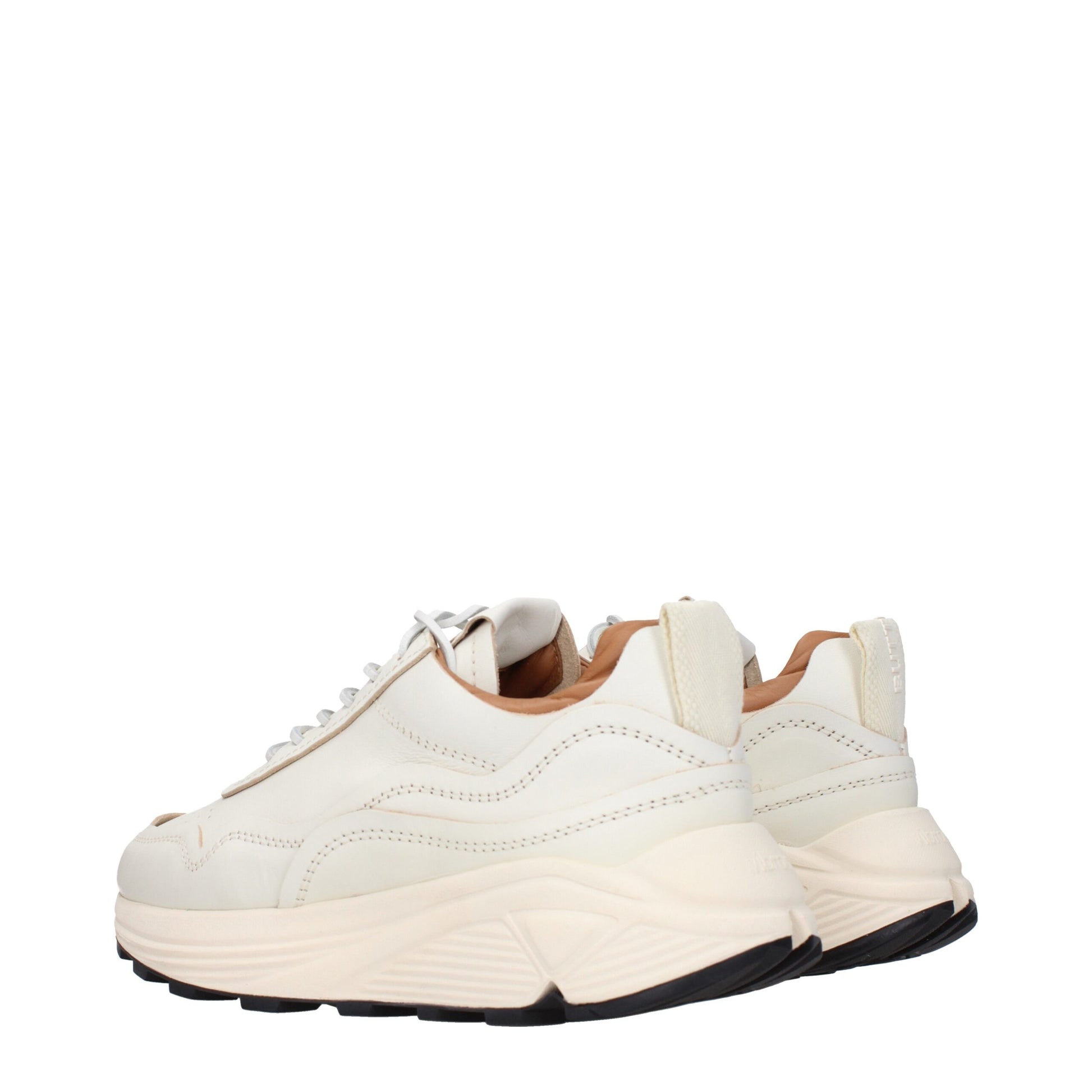 Pair of white leather low top sneakers with laces, featuring a flat sole and a minimalist design