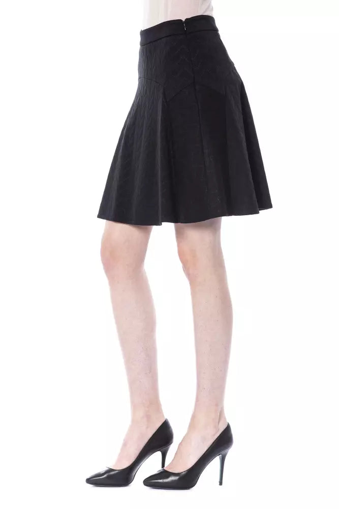 Black pleated skirt worn by a model