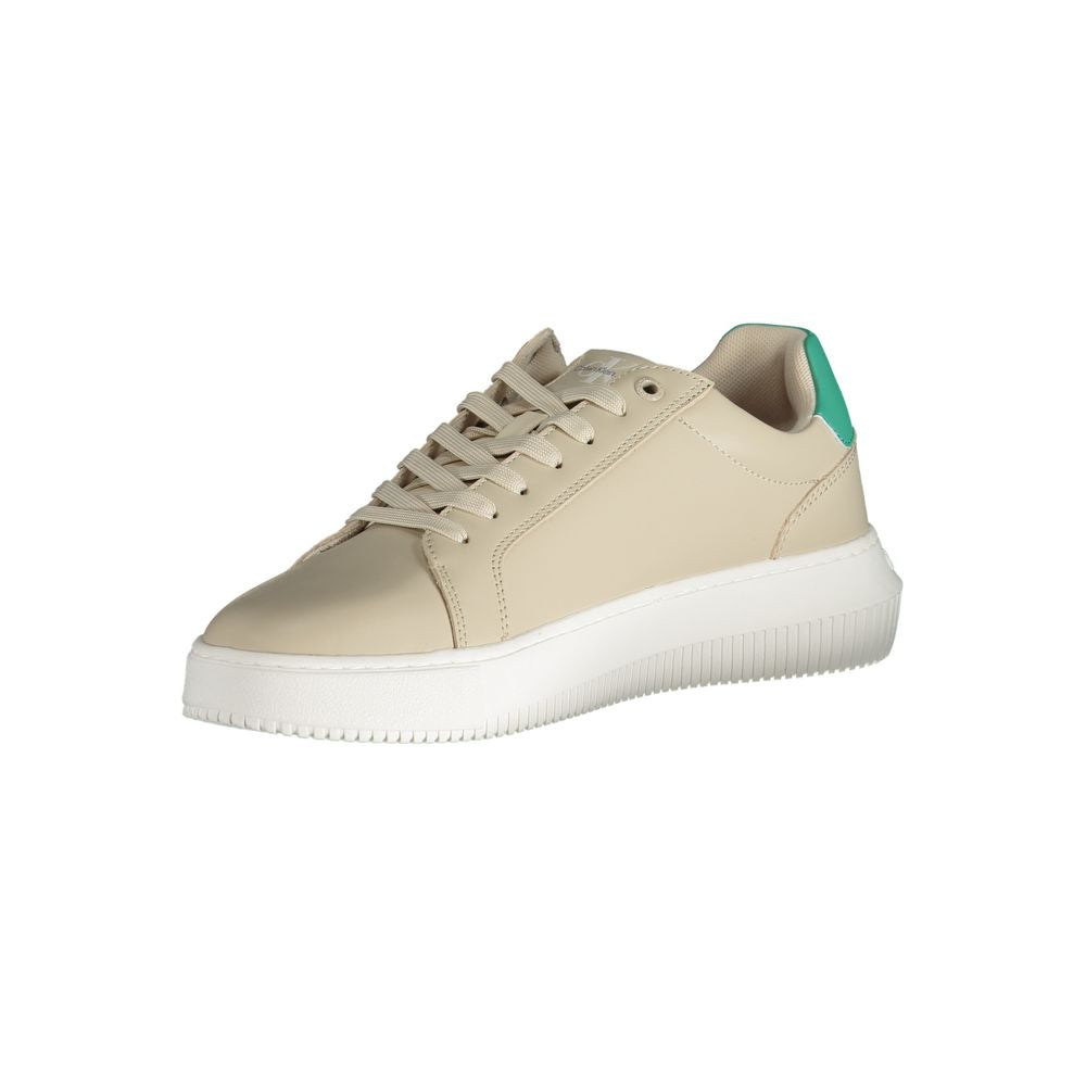 A beige leather men's sneaker with white laces, a low top, and a flat sole
