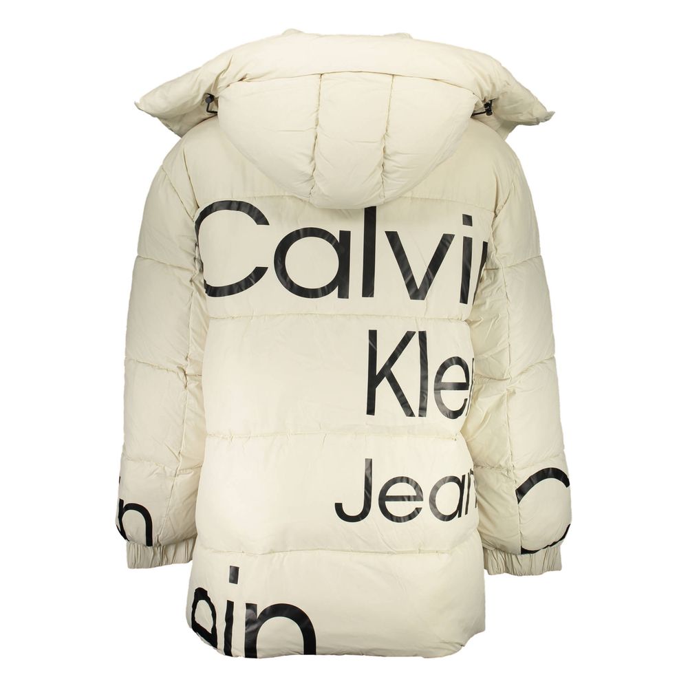 The jacket is beige with white lettering