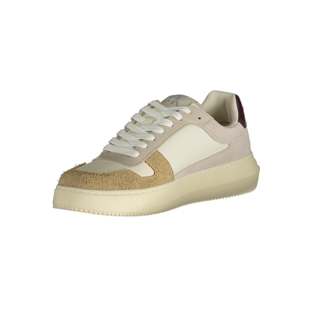 A beige men's sneaker with a textured sole, lace-up front, and brand logo on the side