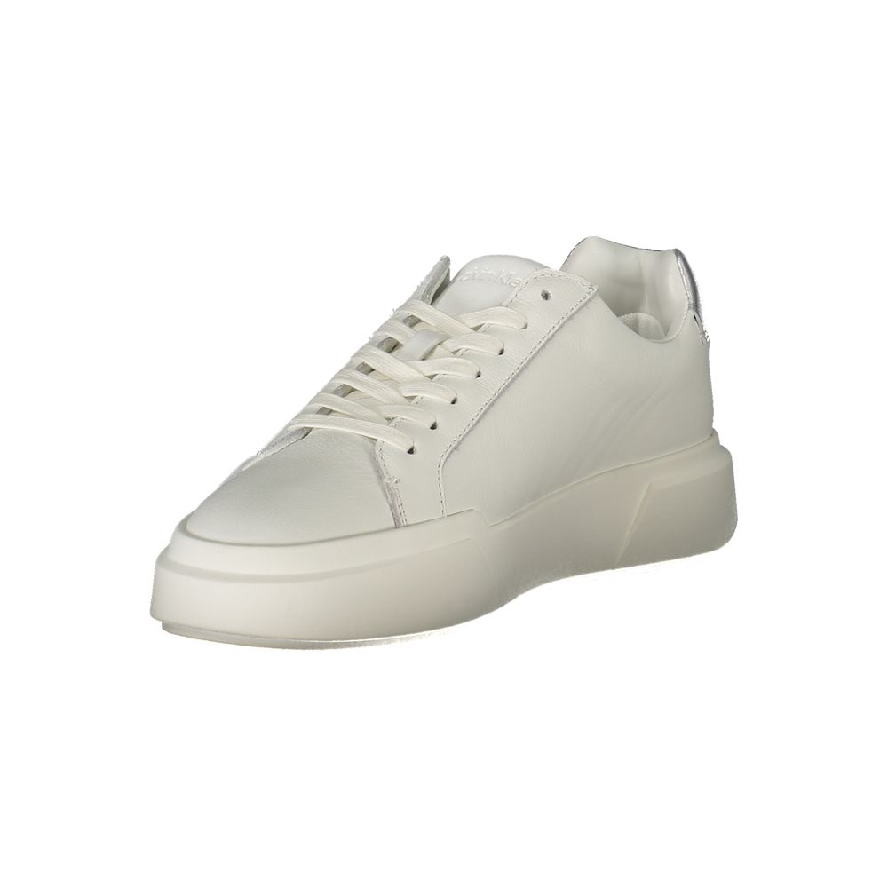 White sneaker with laces, featuring a low top design