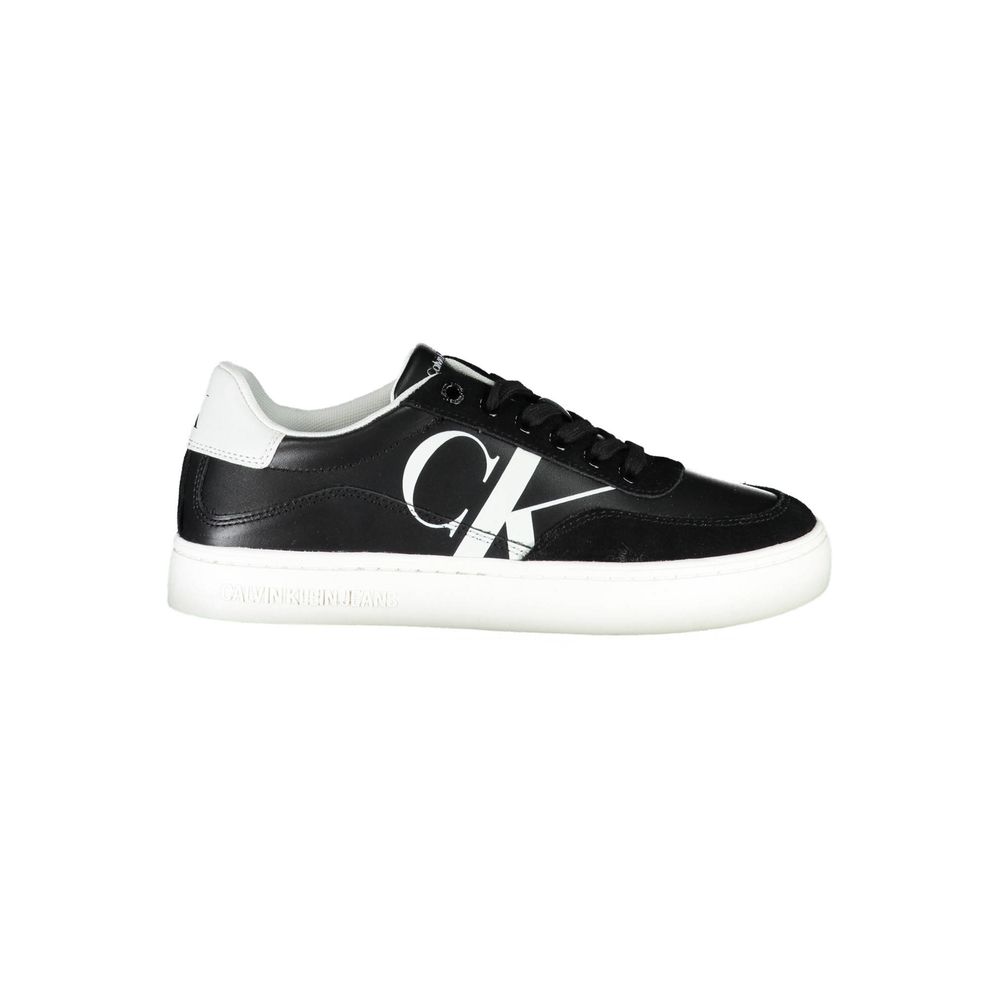 Black sneaker with white sole and logo on side