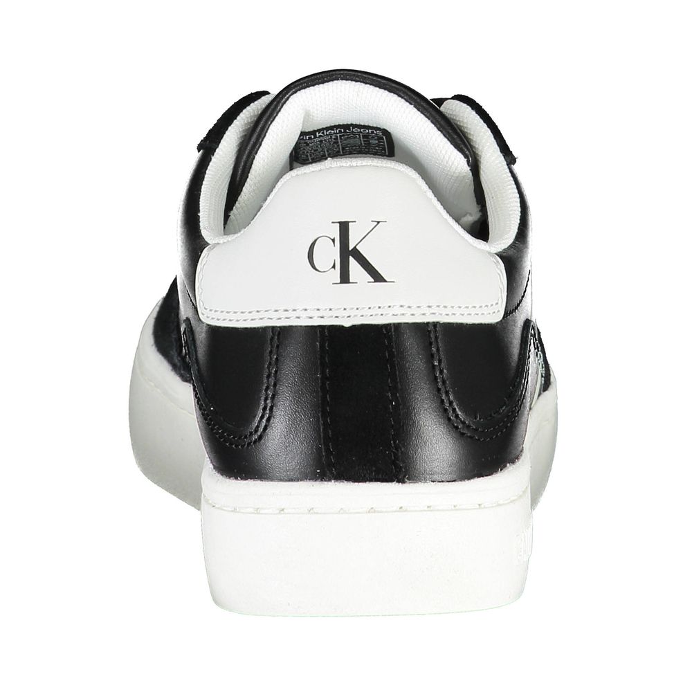 Black and white sneaker with a logo on the side