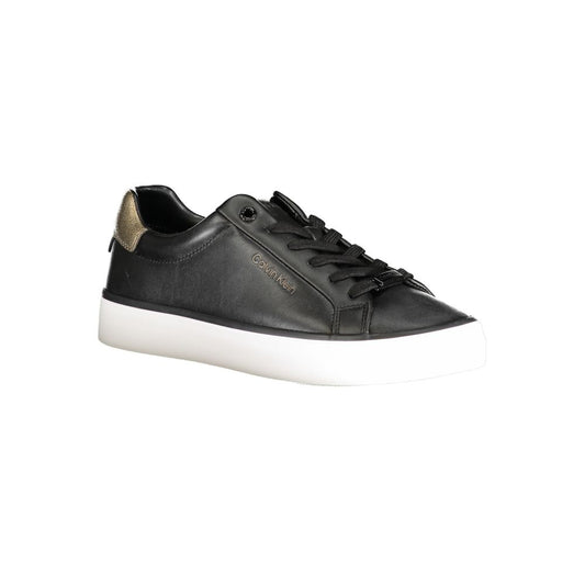 A black leather women's sneaker with white sole, featuring a gold logo on the side
