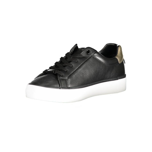 A black leather women's sneaker with white sole, featuring a gold buckle on the side