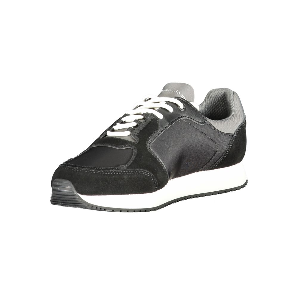 A black polyurethane men's sneaker with white laces, a white sole, and a logo on the side