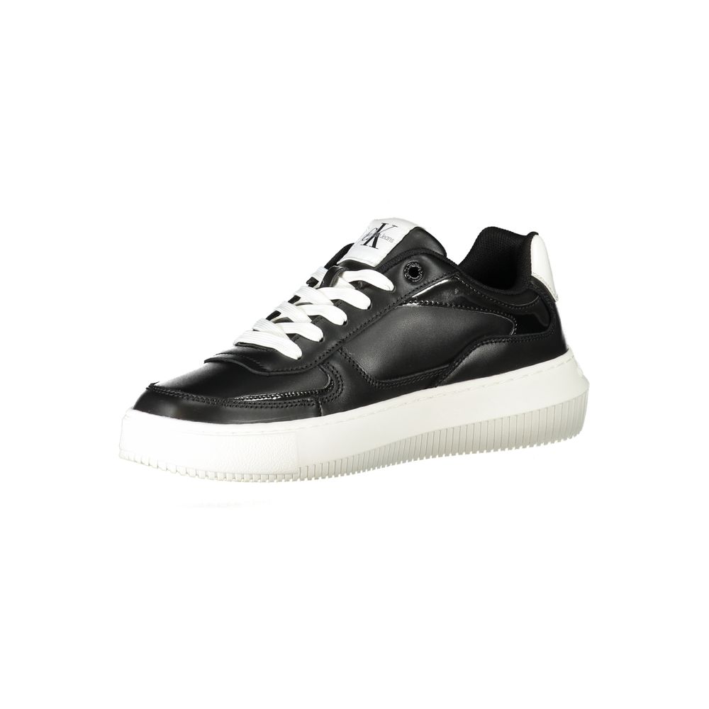 A black women's sneaker with white laces and a white sole