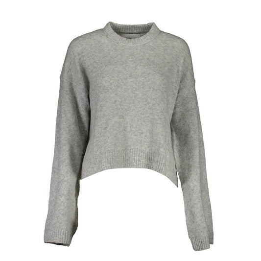 Grey long sleeve sweater on mannequin