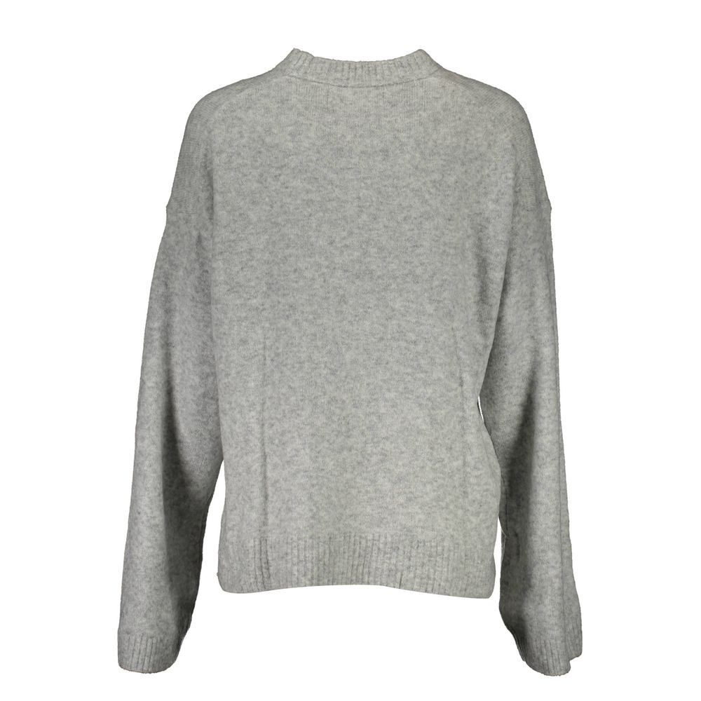 Grey long sleeve sweater on mannequin