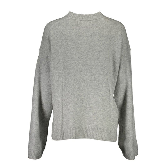 Grey long sleeve sweater on mannequin