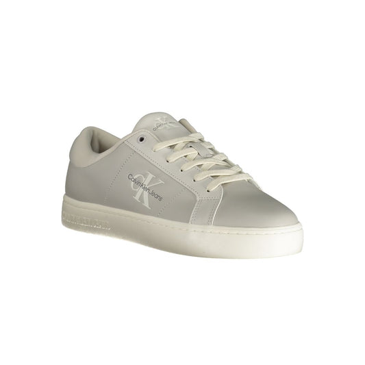 A gray polyurethane men's sneaker with a white sole and laces, featuring the Calvin Klein logo