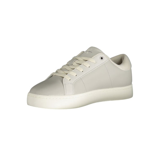 A gray men's sneaker with white laces, a round toe, and a flat sole