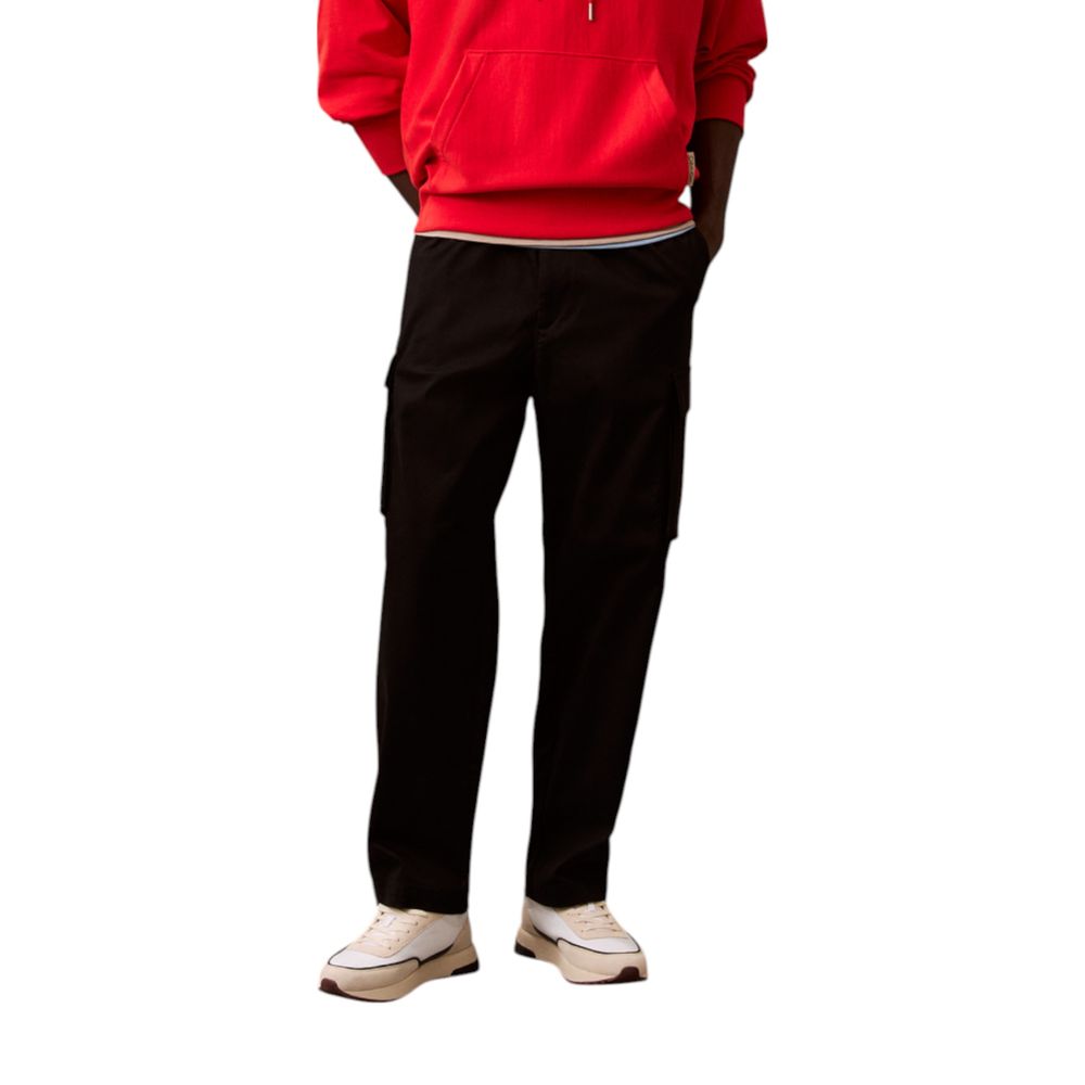 Man wearing red hoodie and black pants