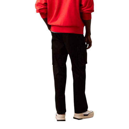 Man wearing red sweatshirt and black pants