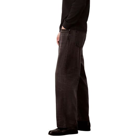 Man wearing black shirt and jeans
