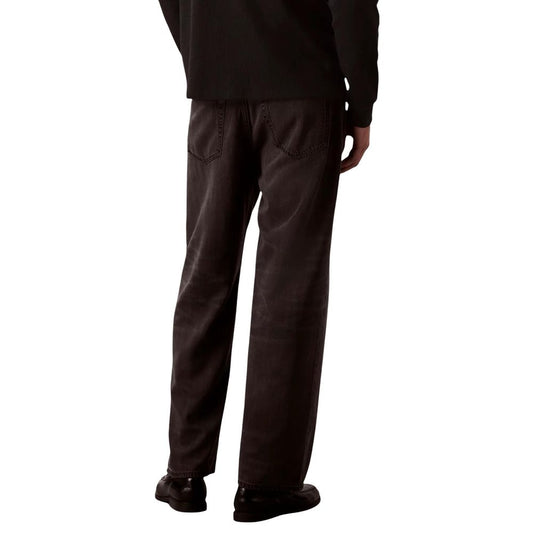 Man wearing black jacket and gray pants