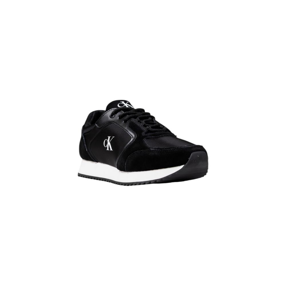 A pair of black athletic sneakers with white soles, featuring a logo on the side and made from polyamide