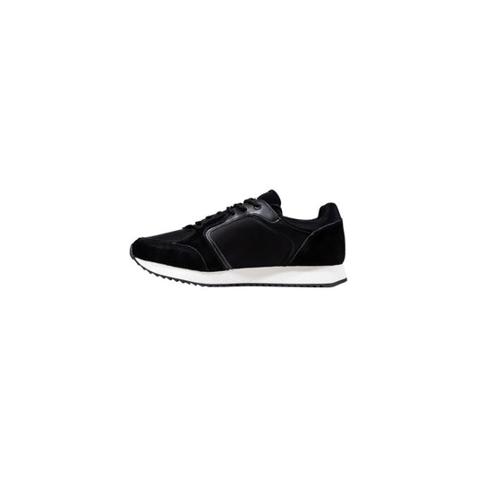 A pair of black athletic sneakers with white soles, designed by Calvin Klein Jeans