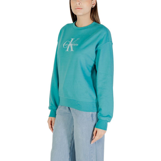 Woman wearing blue sweatshirt with white lettering
