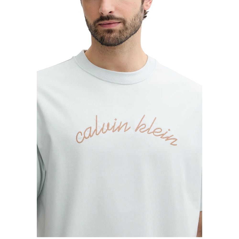 Man wearing white t-shirt with calvin klein logo in beige color
