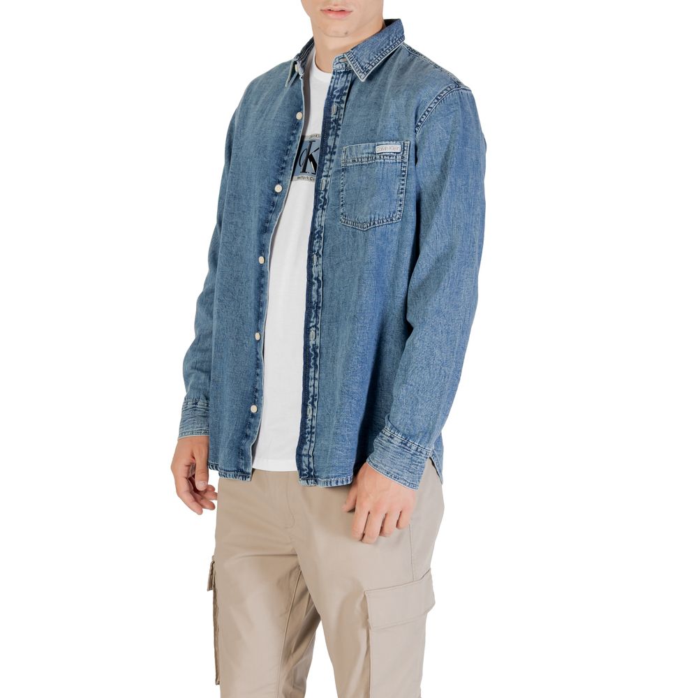 Man wearing blue denim jacket and khaki pants