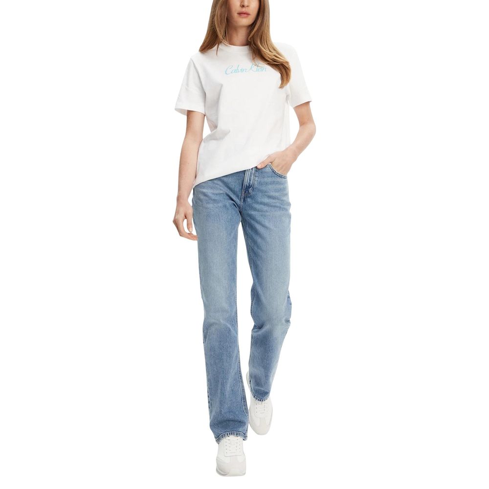 Woman wearing white t-shirt and blue jeans