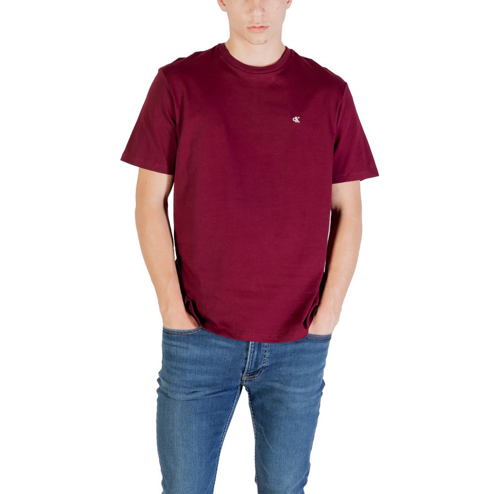 A mannequin wearing a maroon cotton t-shirt with a small white logo on the left chest