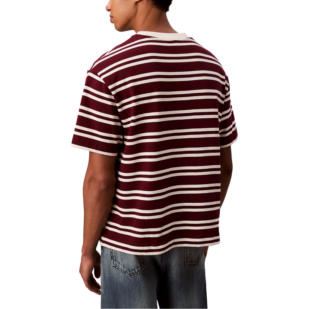 A mannequin wearing a red, white, and black striped t-shirt