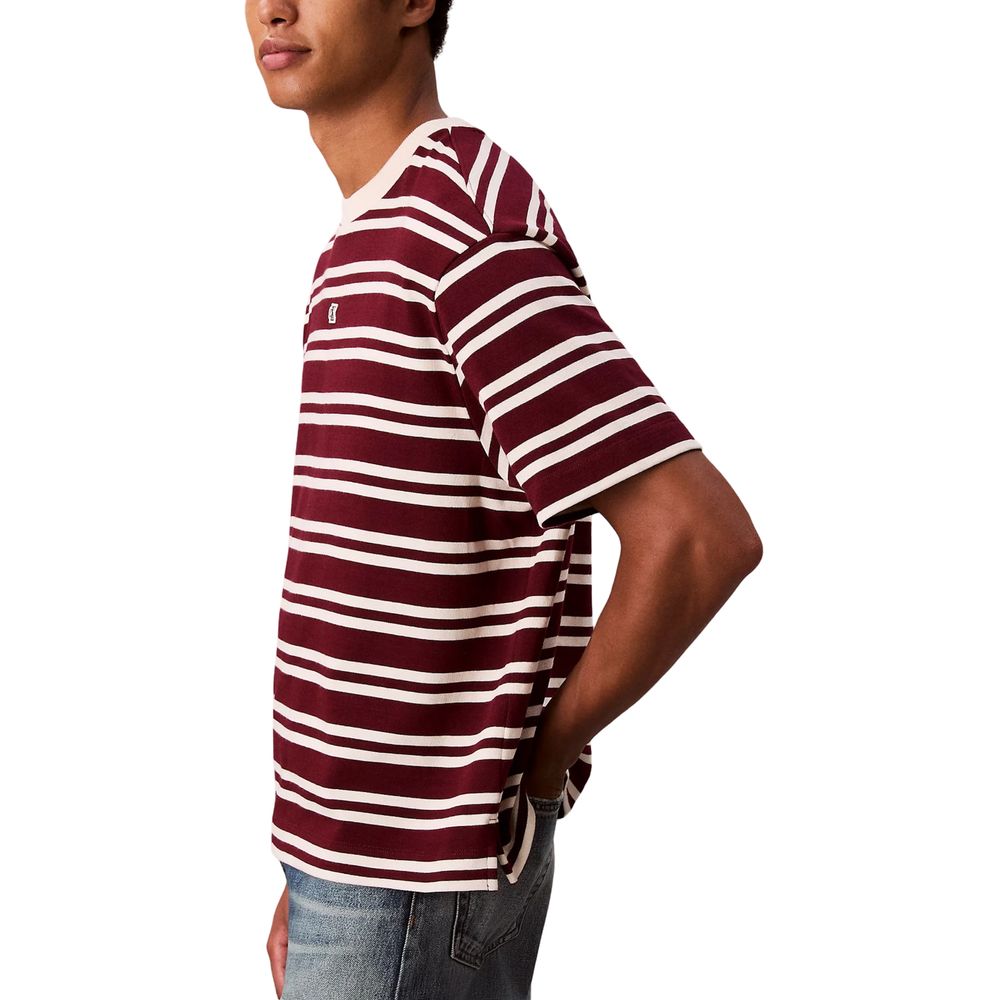 A mannequin wearing a red, white, and black striped t-shirt