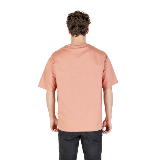 Man wearing pink shirt