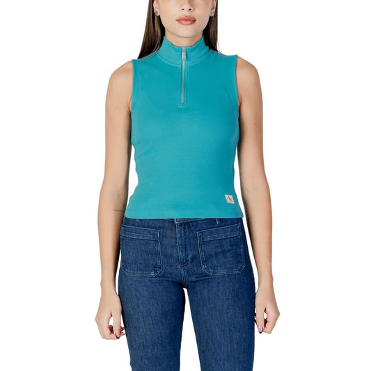 Woman wearing blue top and jeans