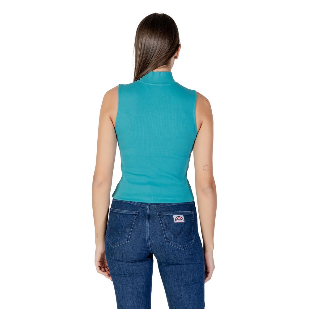 Woman wearing blue jeans and a sleeveless top